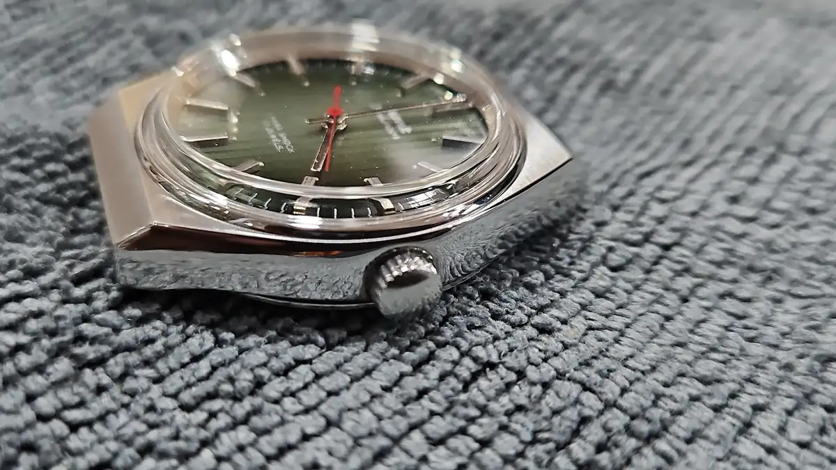 A serviced watch with a green dial on the bench at Jai Bhavani Watch